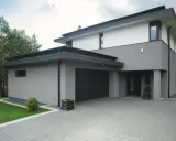 Nowoczesny dom z szarą i białą elewacją, prezentujący najmodniejsze kolory elewacji.